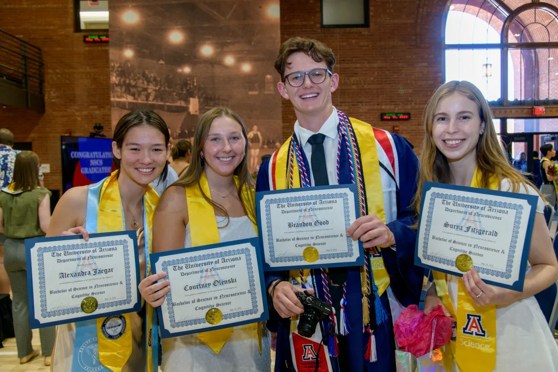 In order from left to right; Alexandra Jaeger, Courtney Olenski, Brandon Good, & Surya Fitzgerald showing off their recently received diplomas.